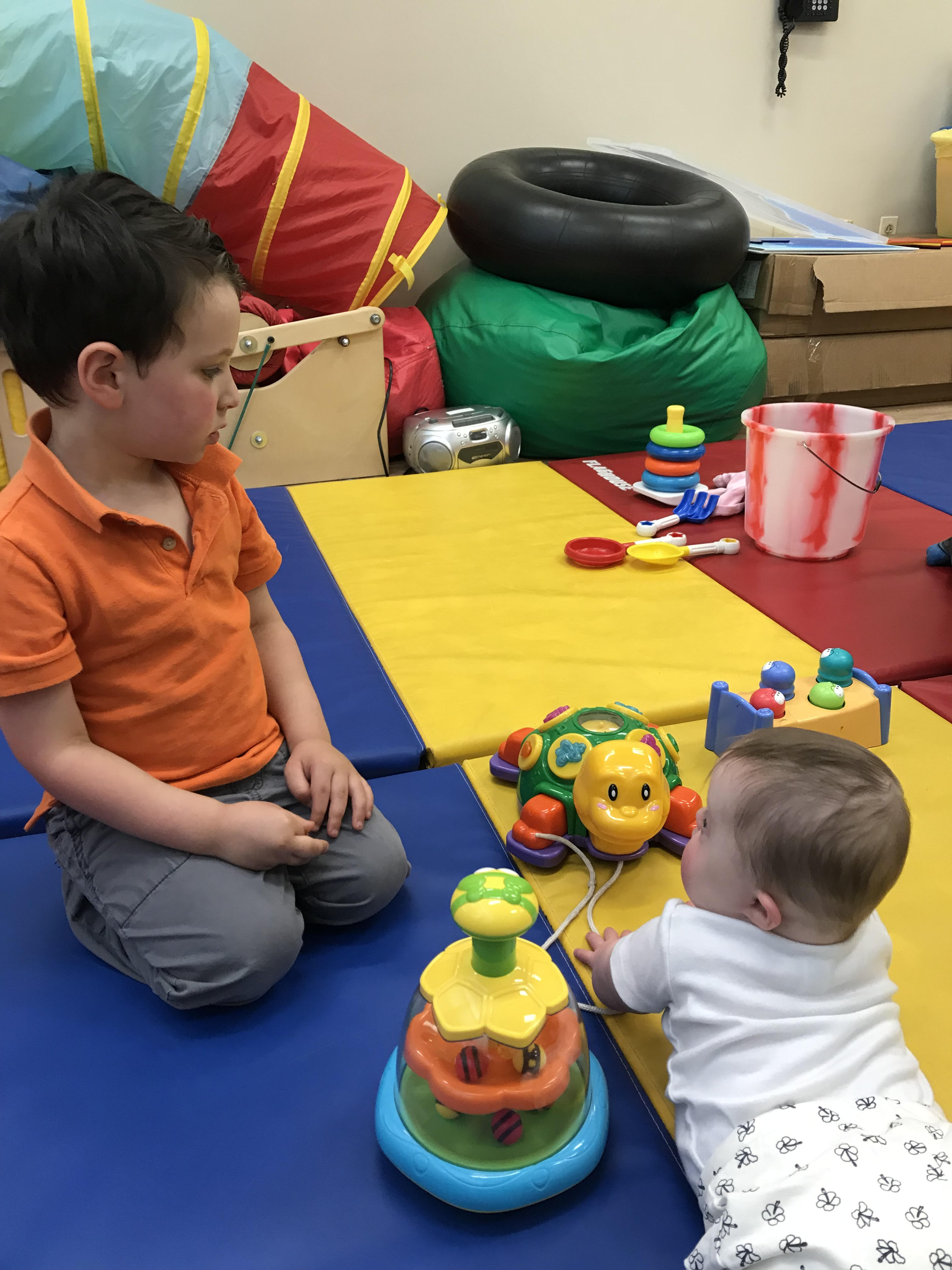 Vera working hard with her brother at Stepping Stones